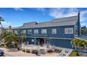 Charming exterior of Fishermen's Village, offering a unique shopping and dining experience in a waterfront setting at 1 Colony Point Dr # 11A, Punta Gorda, FL 33950