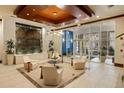 A modern lobby with elegant seating and a tranquil water feature at 100 Central Ave # C619, Sarasota, FL 34236