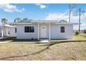 Charming single-story home featuring a well-maintained lawn and a welcoming front entrance at 1075 Falcon Rd, Venice, FL 34293