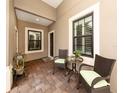 Cozy outdoor patio featuring a table and chairs, perfect for relaxing or entertaining at 11575 Okaloosa Dr, Venice, FL 34293