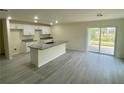 Well-lit kitchen with modern appliances, granite countertops, and an island perfect for entertaining at 2643 Orchard Cir, North Port, FL 34288