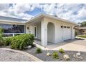 Beautifully maintained home showcases a covered entry and neat landscaping at 325 Fiesole St, Venice, FL 34285