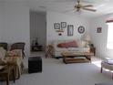 Bright living room with neutral carpet and stylish decor offers a cozy gathering space at 457 Longwood Dr, Venice, FL 34285