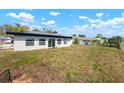 Large backyard with an expansive lawn, providing ample space for outdoor activities and entertainment at 4740 Payne St, North Port, FL 34287