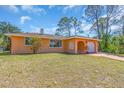 Single story home featuring a cozy design, a well-maintained lawn, and a pleasant, inviting curb appeal at 491 Conrad Rd, Venice, FL 34293