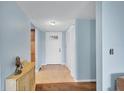 Inviting foyer with a white front door, tile flooring, and neutral decor at 820 Capri Isles Blvd # 202, Venice, FL 34292