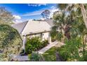 Gorgeous home with lush landscaping, mature palms and a welcoming walkway at 921 Tartan Dr # 31, Venice, FL 34293