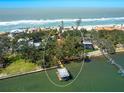 This beautiful home has mature trees, a dock and easy access to the Gulf of Mexico! at 1049 N Casey Key Rd, Osprey, FL 34229