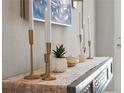 Elegant console table decorated with candles and decorative greenery at 16848 Cayo Key Dr, Port Charlotte, FL 33953