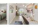 Inviting hallway leads to a bright living area, complemented by tasteful decor at 16848 Cayo Key Dr, Port Charlotte, FL 33953
