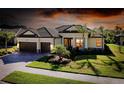 Charming home featuring a tile roof, two-car garage, lush landscaping, and an inviting entrance at 20794 Valprato Ct, Venice, FL 34293