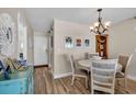 Cozy dining area with chandelier lighting and stylish decor at 232 Saint Augustine Ave # 802, Venice, FL 34285