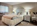 Comfortable bedroom with a white bed frame, soft lighting, and coordinating nightstands at 3224 Mount Hope St, North Port, FL 34287