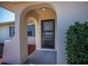 Covered entryway with decorative front door at 358 Pineview Dr, Venice, FL 34293