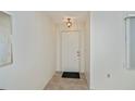 Bright entryway featuring neutral walls and tiled flooring at 358 Pineview Dr, Venice, FL 34293