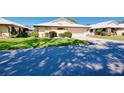Charming one-story home with well-manicured lawn and lush landscaping at 49 Sandstone Cir, Venice, FL 34293