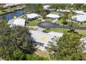Desirable waterfront home featuring lush landscaping and a private dock on a tranquil canal at 51 Oakwood N Dr # 51, Englewood, FL 34223