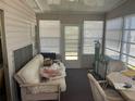 Enclosed sunroom with multiple windows offering lots of natural light at 733 Roma Rd, Venice, FL 34285