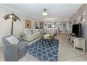 Inviting living room featuring comfortable seating, stylish decor, and plenty of natural light at 950 Tarpon Center Dr # 506, Venice, FL 34285