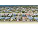 Expansive neighborhood with neatly arranged homes, some featuring pools and well-maintained landscaping at 1048 Ulrey Ln, Englewood, FL 34223