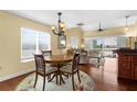 Bright living room with wood floors, vaulted ceilings, and access to a private balcony at 109 Bayshore Rd # 10, Nokomis, FL 34275
