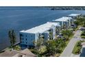 Exterior view of a coastal condominium with balconies overlooking the water at 1750 Jamaica Way # 322, Punta Gorda, FL 33950
