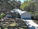 Charming single-Gathering home with mature trees and well-maintained landscaping at 1769 Manasota Beach Rd, Englewood, FL 34223