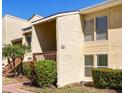 Condo exterior highlighting the covered entryway and well-maintained landscaping at 3417 Clark Rd # 217, Sarasota, FL 34231