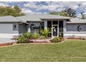 Well maintained front yard with grass, manicured landscaping, and mulch around the house at 4070 Kincord Ln, North Port, FL 34287