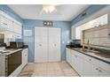 Bright kitchen featuring ample cabinet space, modern appliances, and tile flooring at 4437 Tippecanoe Trl # 6, Sarasota, FL 34233