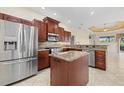 Modern kitchen features stainless steel appliances, granite countertops, and a functional center island at 6210 Cormorant Ct, Bradenton, FL 34203