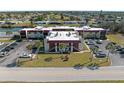 Well-maintained condo building with lush green surroundings and parking at 66 Boundary Blvd # 275, Rotonda West, FL 33947