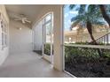 An enclosed porch provides views of the beautiful manicured landscaping at 7104 L Pavia Blvd # 7104, Venice, FL 34292