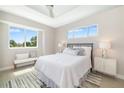 Bright bedroom with large windows, neutral decor, and stylish furniture at 7407 S Blue Sage, Punta Gorda, FL 33955