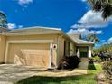 Charming single-story home with a two-car garage, well-maintained landscaping, and inviting curb appeal at 875 Chalmers Dr, Venice, FL 34293