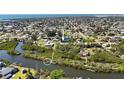 An aerial view showcasing the property's waterfront location, situated on a canal with access to the open water at 951 Sea Fox Rd, Venice, FL 34293