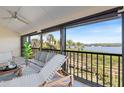 Screened balcony offers views of the water and surrounding tropical landscaping at 990 Bird Bay Way # 258, Venice, FL 34285