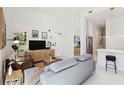 Spacious living room featuring modern decor, neutral colors, and plenty of natural light at 1558 4Th St # 208, Sarasota, FL 34236