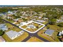 Aerial view of the property showcasing its location within a quiet neighborhood at 1600 Maryknoll Rd, Englewood, FL 34223