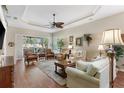 Inviting living room showcasing tray ceilings, and neutral tones for a warm ambiance at 1627 Lancashire Dr, Venice, FL 34293