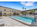 Relaxing pool area with lounge chairs, creating a vacation vibe at 200 Park N Blvd # 108, Venice, FL 34285