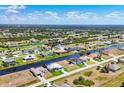 Scenic aerial view of waterfront homes, canals, and community landscaping in a desirable residential neighborhood at 226 W Pine Valley Ln, Rotonda West, FL 33947