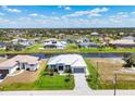 Waterfront home showcases lush lawns and landscaping, canal views, and a charming single-story home at 226 W Pine Valley Ln, Rotonda West, FL 33947