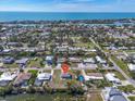 An aerial view shows the neighborhood and the proximity to the ocean from this house at 328 Channel Ln, Nokomis, FL 34275