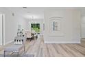 Bright living room seamlessly connected to the dining area with stylish decor at 3470 Elias Cir, North Port, FL 34288