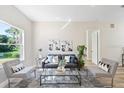 Cozy living room with ample natural light, modern furniture and neutral tones at 3470 Elias Cir, North Port, FL 34288