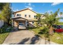 Two story house with a carport and long concrete driveway at 440 Monza Ave, North Port, FL 34287