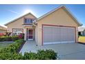 Attractive single-Gathering home featuring a well-kept lawn and decorative landscaping at 589 Rose Apple Circle, Port Charlotte, FL 33954