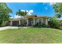 Charming single-story home boasts mature landscaping, a two-car garage, and a welcoming front entrance at 740 Tanager Rd, Venice, FL 34293