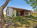 Lovely single-story home with well-maintained landscaping, a stone walkway, and a cozy front porch at 7515 Greystone Dr, Hudson, FL 34667